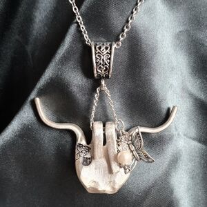 Cute highland cow made from a vintage silver fork